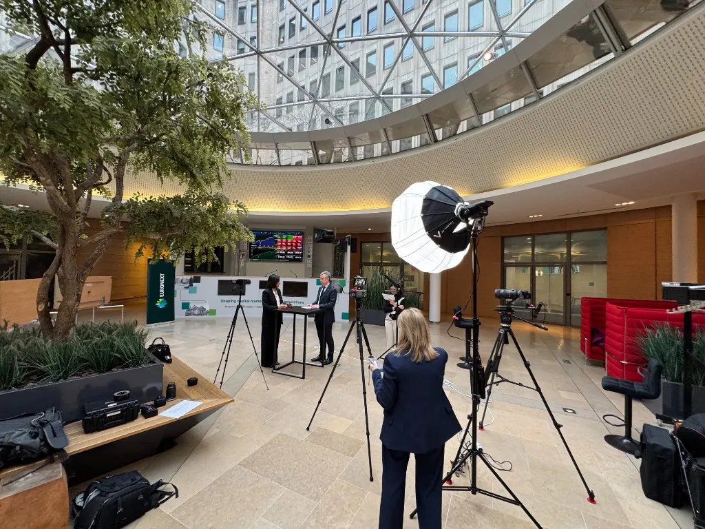 Multi-camera setup filming two people at Euronext Brussels