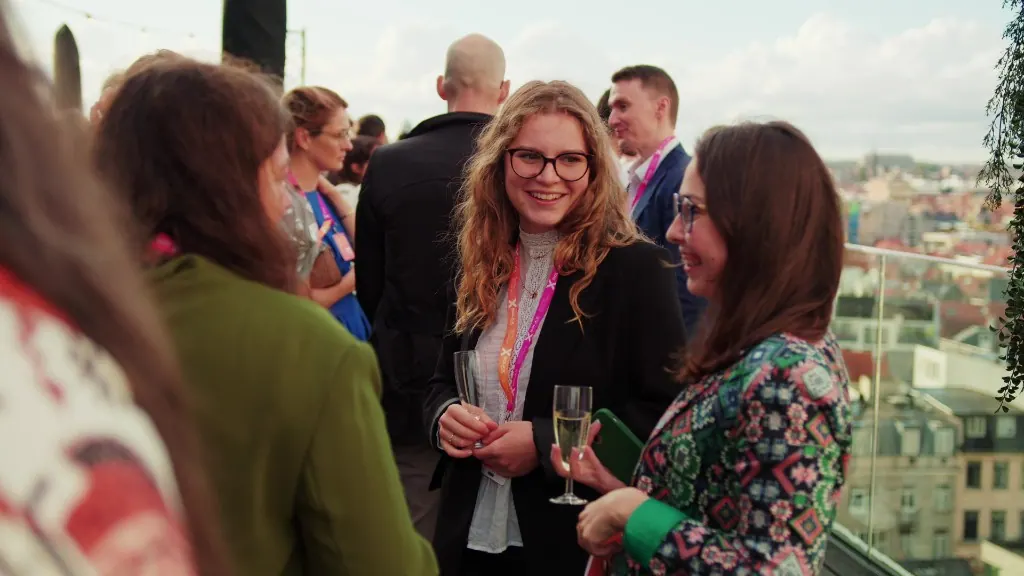 Guests talking on a Brussels rooftop for SolarPower Europe